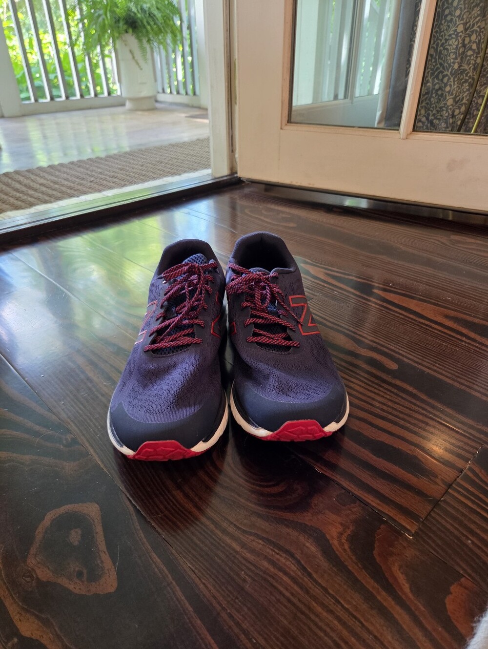 New Balance Navy Running Shoes with Red Accents